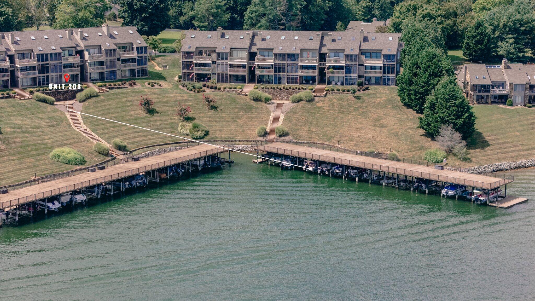 845 Gangplank Road, Unit 203 Moneta, VA 24121 - Photo 40 of 46 an aerial view of a house with a garden and lake view