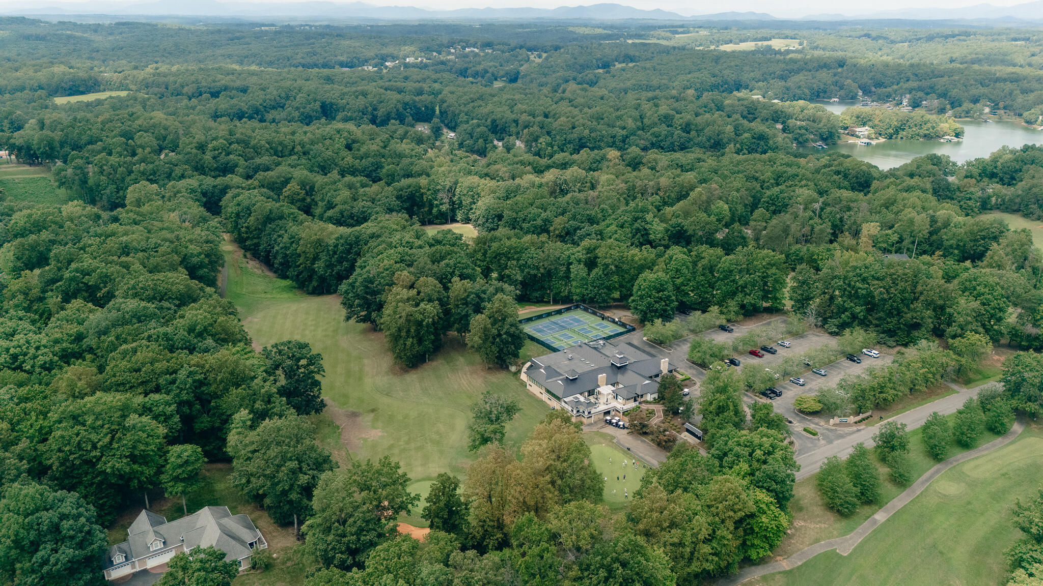 845 Gangplank Road, Unit 203 Moneta, VA 24121 - Photo 45 of 46 an aerial view of a forest with houses