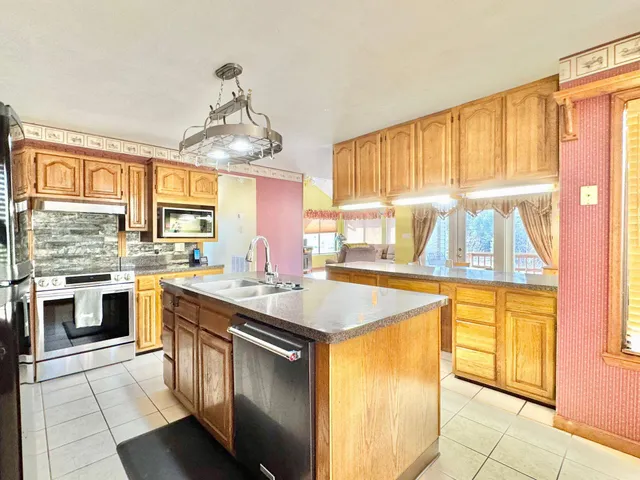 a view of living room with furniture and floor to ceiling window