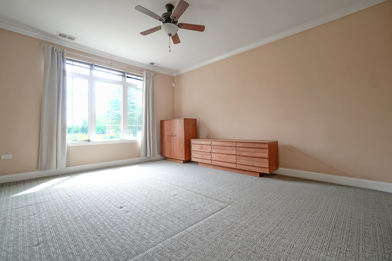 620 McHenry Road, Unit 105 Wheeling, IL 60090 - Photo 13 of 20 a view of an empty room with a window