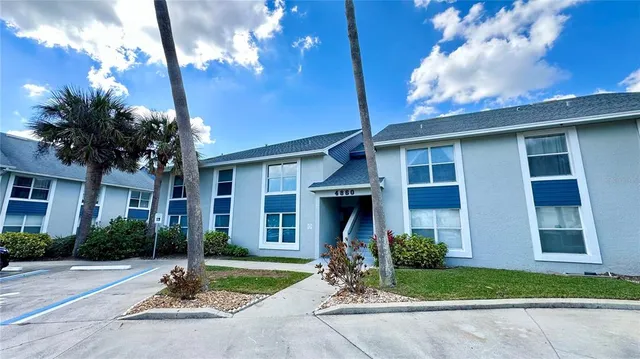 a view of a two chairs in the balcony