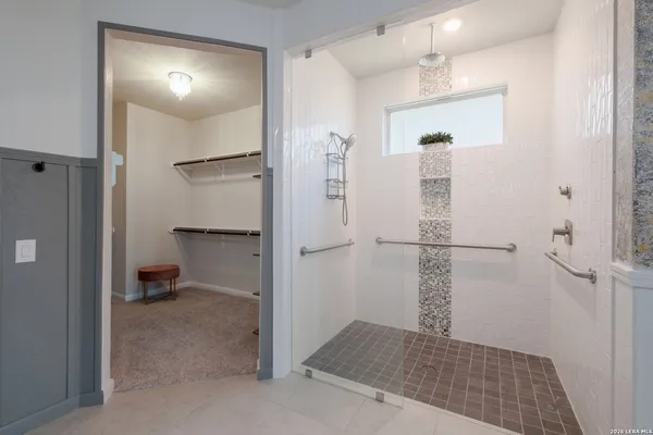 a bathroom with a shower and toilet