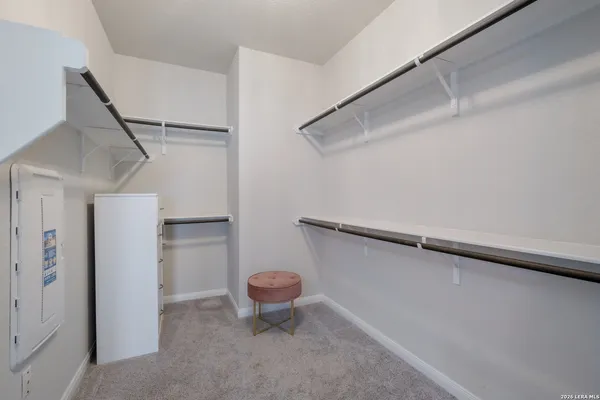 a view of a room with wooden walls