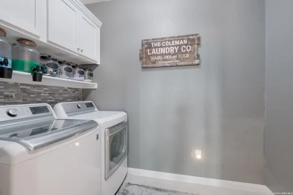 a view of storage and utility room with washer and dryer