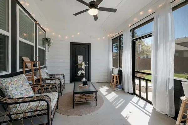 a room with furniture or window and a chandelier