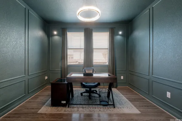 a dining room with furniture and window