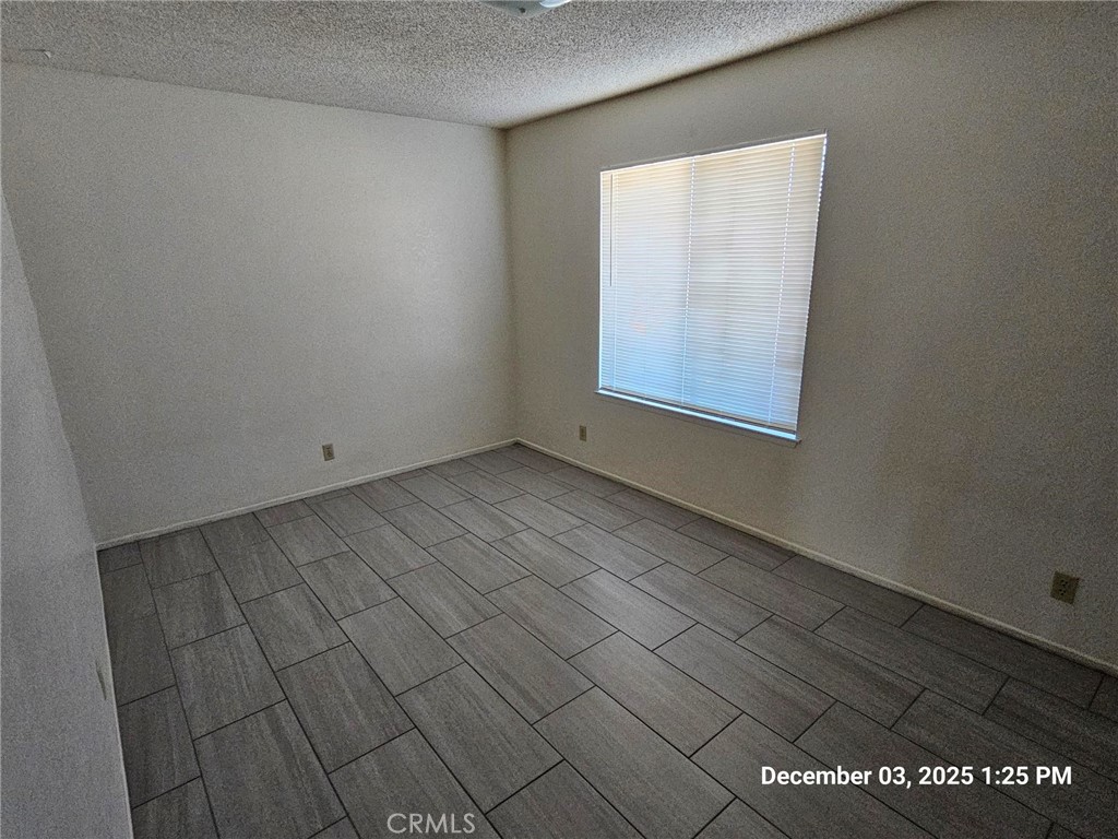 18891 Rock Springs Road Hesperia, CA 92345 - Photo 16 of 25 a view of an empty room and window