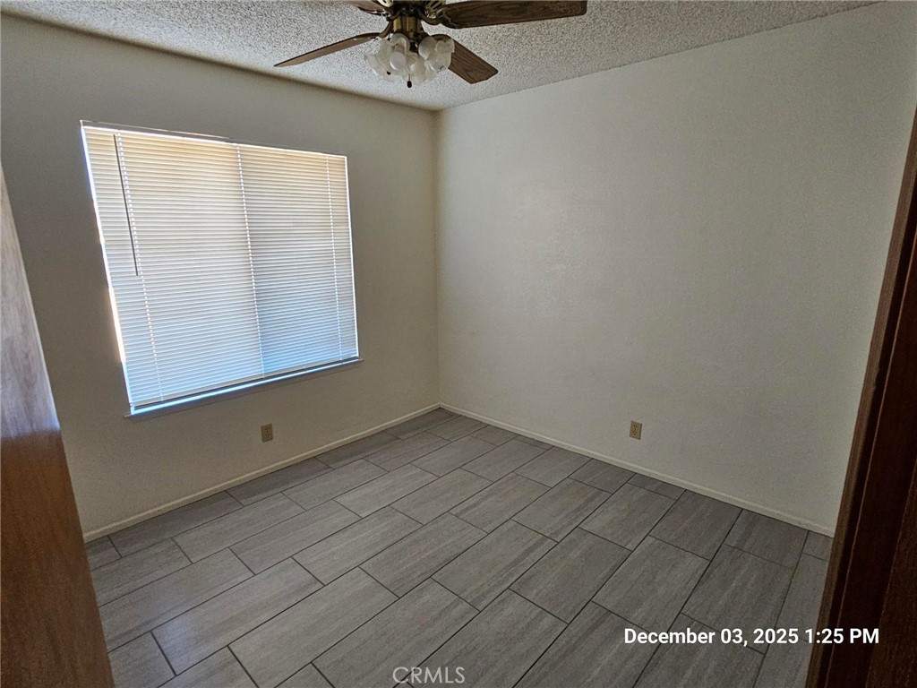 18891 Rock Springs Road Hesperia, CA 92345 - Photo 17 of 25 an empty room with a window