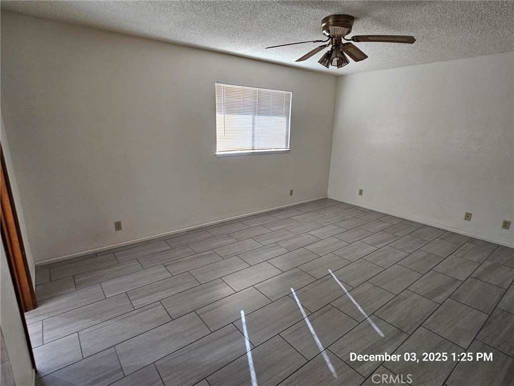 18891 Rock Springs Road Hesperia, CA 92345 - Photo 19 of 25 an empty room with windows