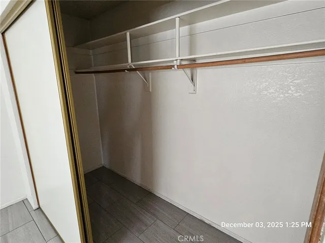 a white toilet sitting next to a shower