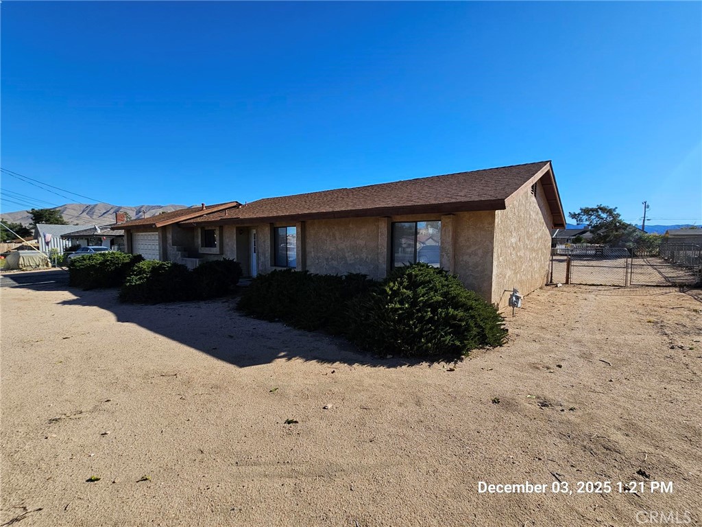 18891 Rock Springs Road Hesperia, CA 92345 - Photo 2 of 25 a view of a house with a yard