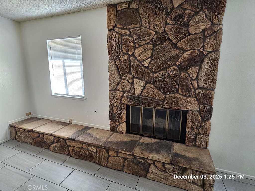 18891 Rock Springs Road Hesperia, CA 92345 - Photo 9 of 25 a spacious bedroom with a bed and a window