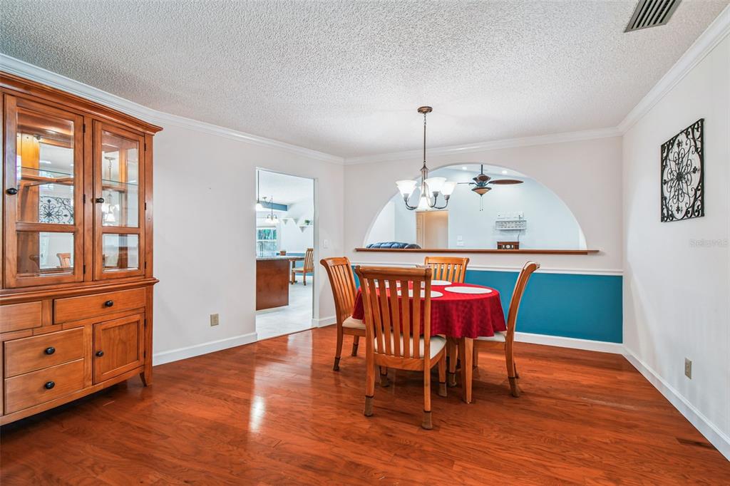 6006 Redhawk Drive New Port Richey, FL 34655 - Photo 13 of 90 a view of a dining room with furniture window and wooden floor