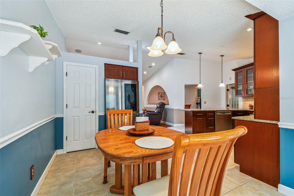 6006 Redhawk Drive New Port Richey, FL 34655 - Photo 26 of 90 a view of a dining room with furniture and a chandelier