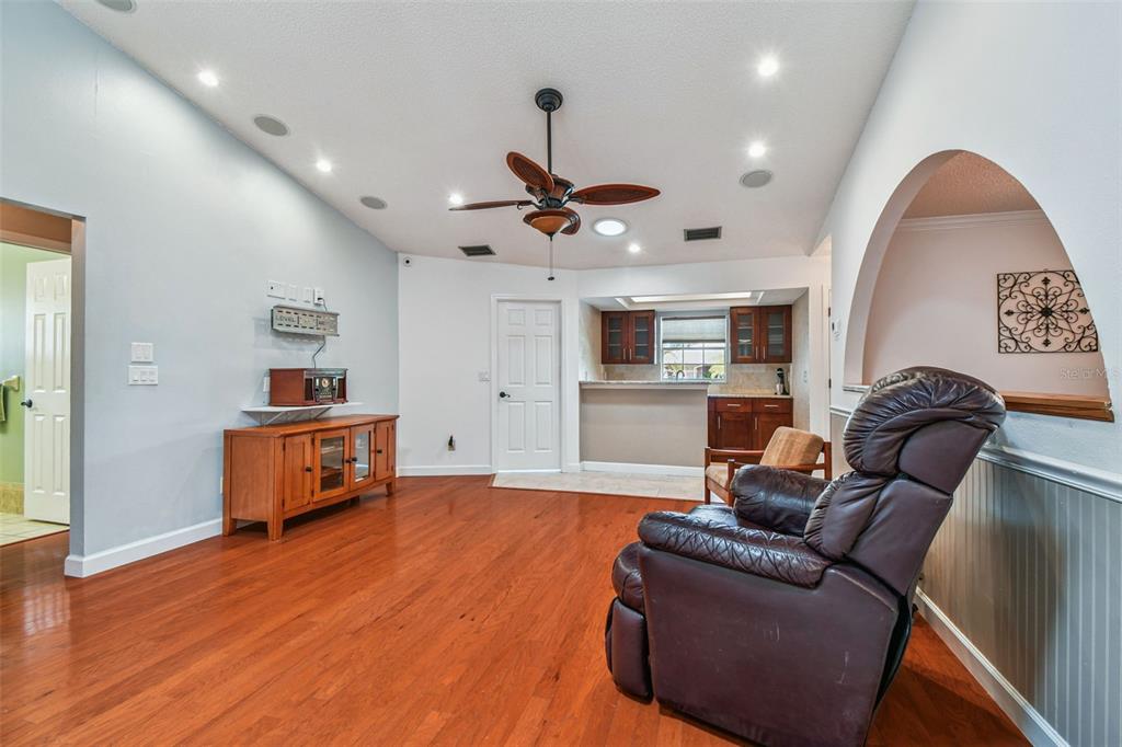 6006 Redhawk Drive New Port Richey, FL 34655 - Photo 28 of 90 a living room with furniture and kitchen view