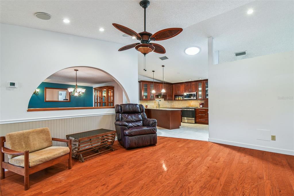 6006 Redhawk Drive New Port Richey, FL 34655 - Photo 30 of 90 a living room with furniture and a chandelier