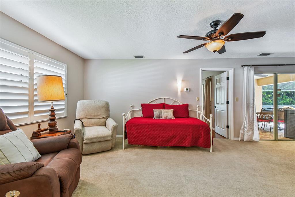6006 Redhawk Drive New Port Richey, FL 34655 - Photo 45 of 90 a living room with furniture and a ceiling fan