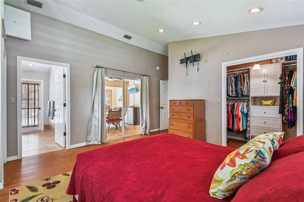 6006 Redhawk Drive New Port Richey, FL 34655 - Photo 56 of 90 a bedroom with a bed and a large mirror