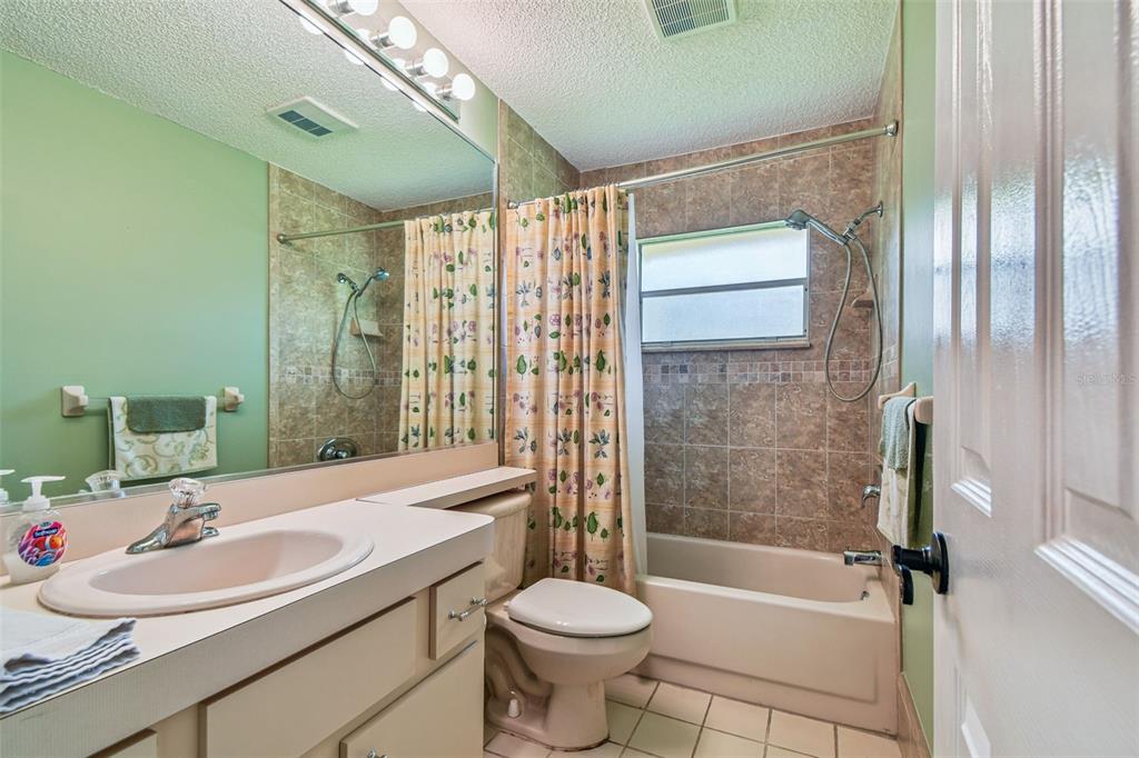 6006 Redhawk Drive New Port Richey, FL 34655 - Photo 64 of 90 a bathroom with a sink toilet and shower