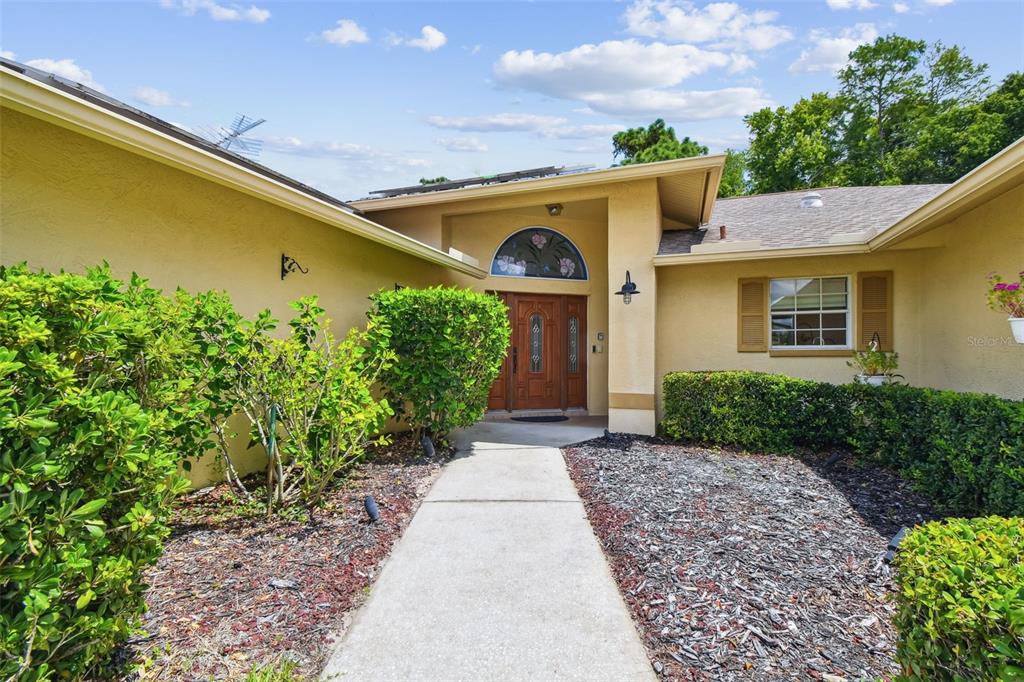 6006 Redhawk Drive New Port Richey, FL 34655 - Photo 8 of 90 a front view of a house with garden