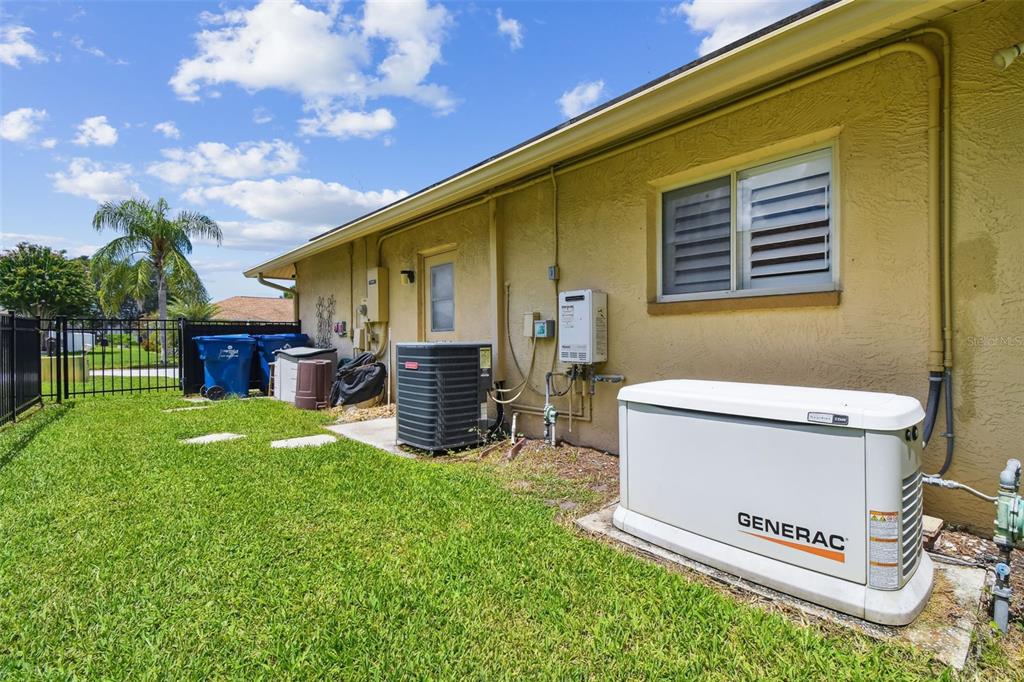 6006 Redhawk Drive New Port Richey, FL 34655 - Photo 85 of 90 a view of backyard with wooden fence and a large tree