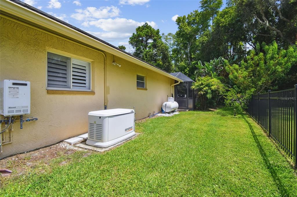 6006 Redhawk Drive New Port Richey, FL 34655 - Photo 86 of 90 a backyard of a house with table and chairs