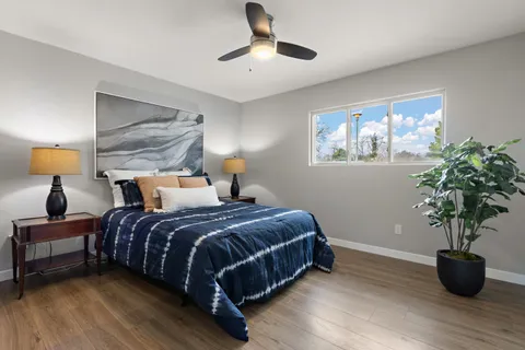 a bedroom with bed and window