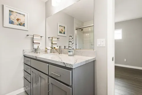 a bathroom with a sink and a mirror