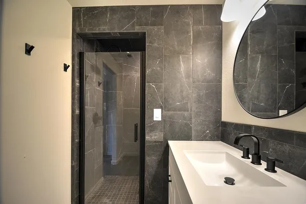 a bathroom with a sink and a mirror
