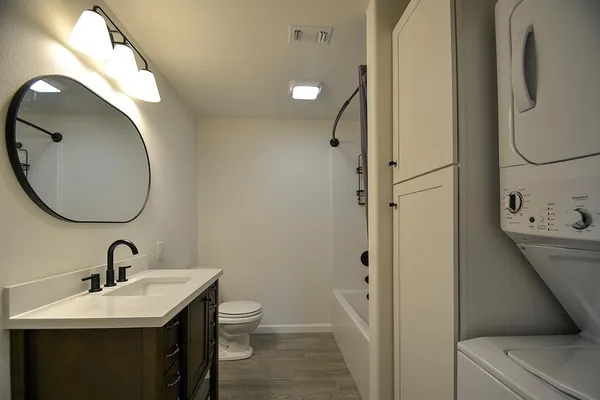 a bathroom with a sink and mirror
