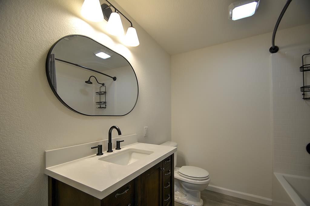 110 A Garner Road Kerrville, TX 78028 - Photo 24 of 46 a bathroom with a sink and a mirror