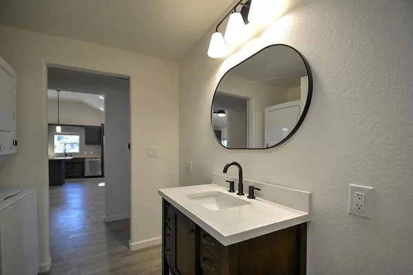 a en suite bathroom with a sink and a mirror