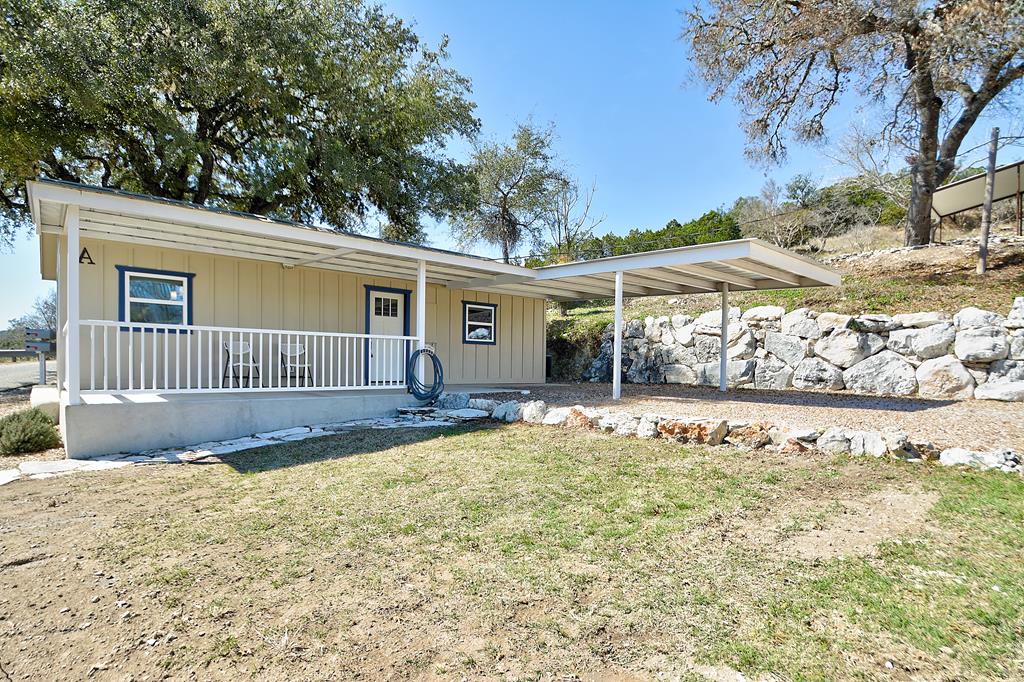 110 A Garner Road Kerrville, TX 78028 - Photo 31 of 46 a view of a house with a big yard and large tree