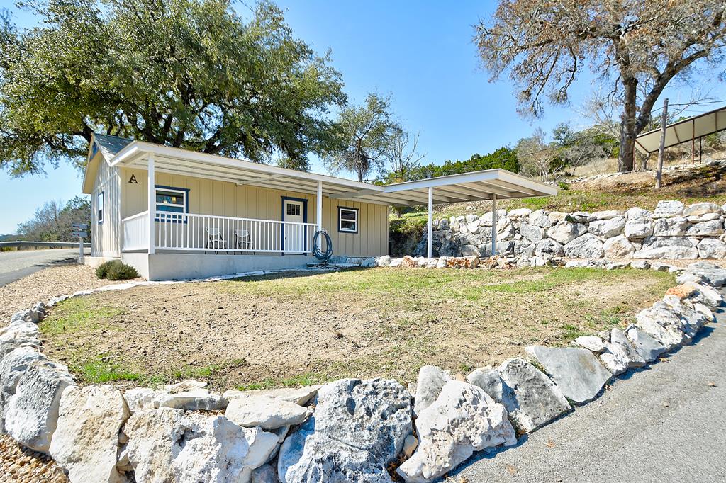 110 A Garner Road Kerrville, TX 78028 - Photo 32 of 46 a view of a house with a yard