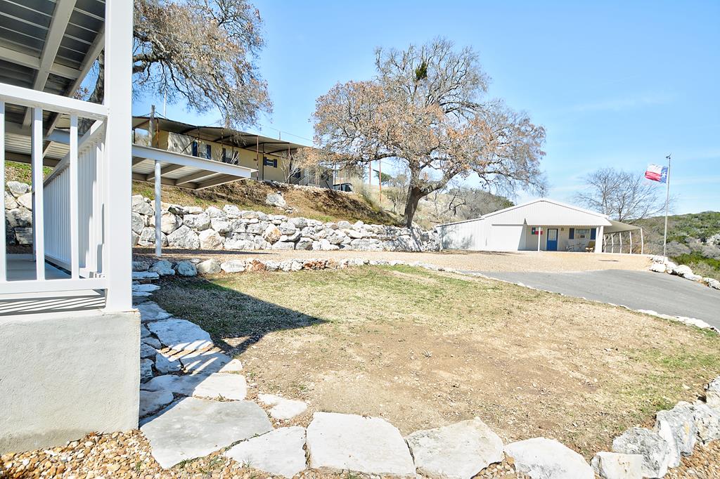 110 A Garner Road Kerrville, TX 78028 - Photo 33 of 46 a house view with swimming pool and sitting area