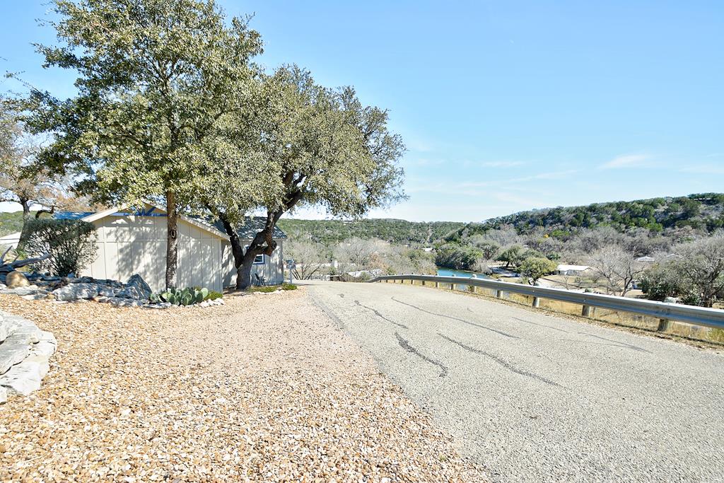 110 A Garner Road Kerrville, TX 78028 - Photo 38 of 46 a view of a road with a yard