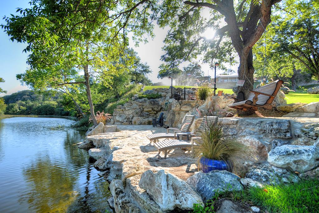 110 A Garner Road Kerrville, TX 78028 - Photo 43 of 46 a view of swimming pool with lawn chairs and plants