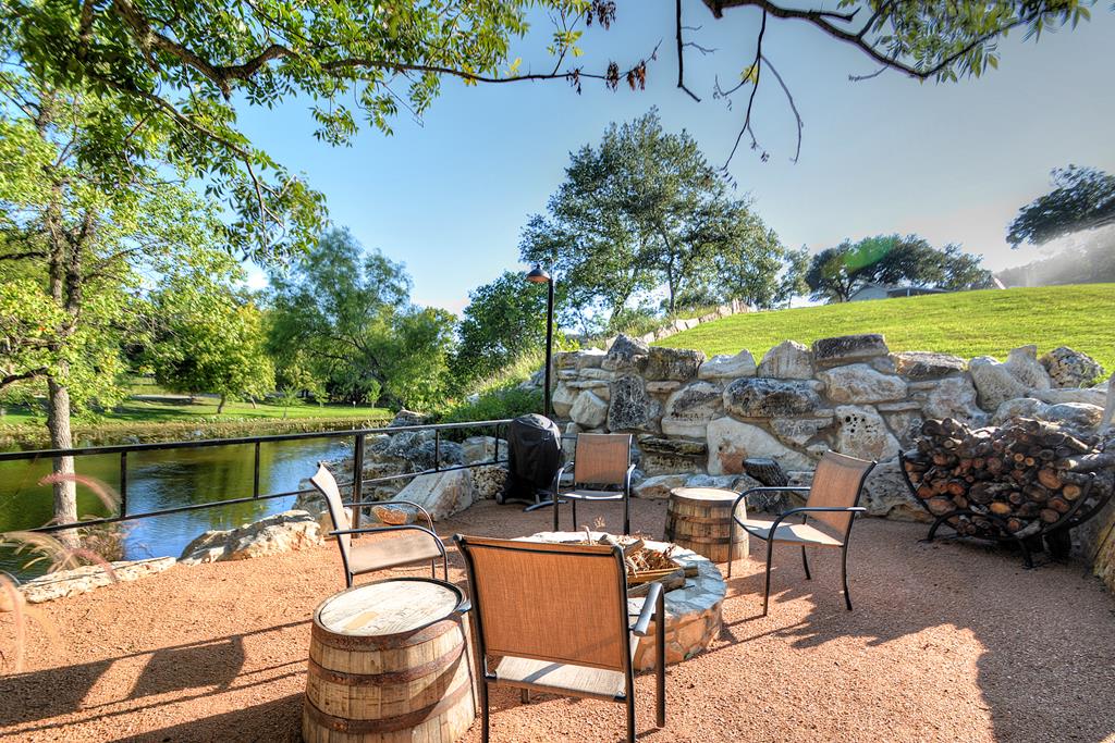 110 A Garner Road Kerrville, TX 78028 - Photo 45 of 46 a view of a lake with outdoor seating space