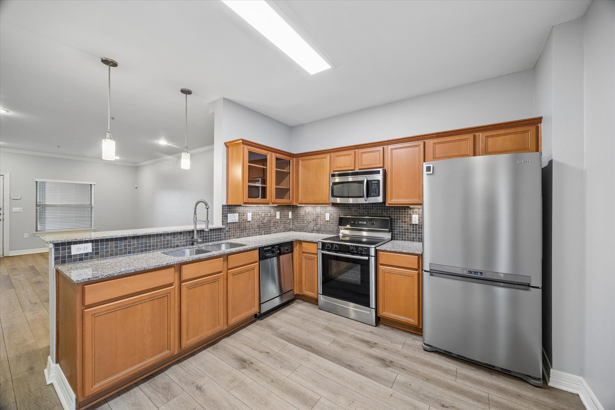 3501 Chenevert Street, Unit 7 Houston, TX 77004 - Photo 7 of 21 Fully equipped kitchen with stainless steel appliances and ample storage.