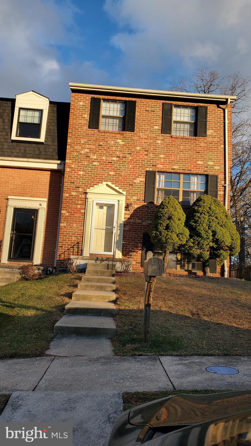 a front view of a house with yard