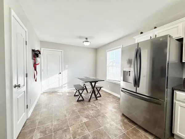 a kitchen with stainless steel appliances a refrigerator and a refrigerator