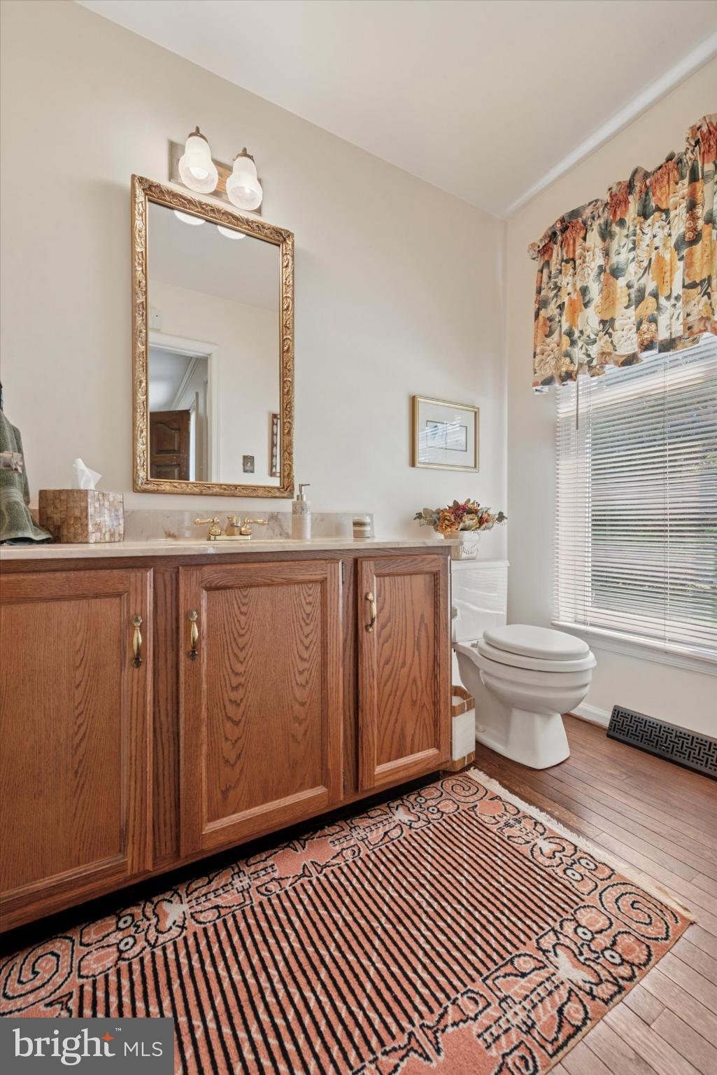 856 Monteith Drive Wayne, PA 19087 - Photo 22 of 35 a bathroom with a sink toilet and mirror
