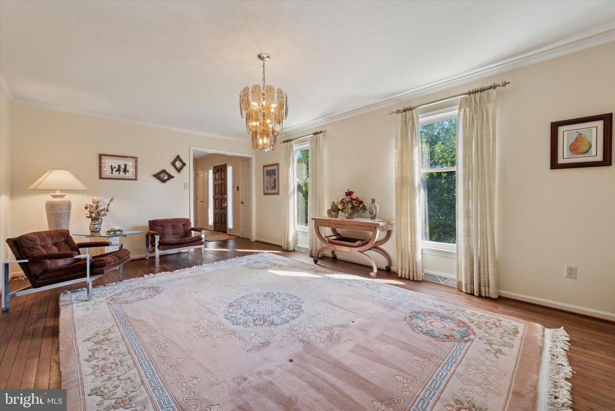 856 Monteith Drive Wayne, PA 19087 - Photo 23 of 35 a spacious bedroom with a bed a table and chair