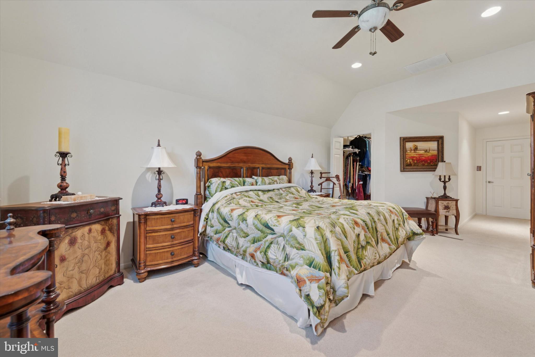 856 Monteith Drive Wayne, PA 19087 - Photo 26 of 35 a spacious bedroom with a bed and a chandelier