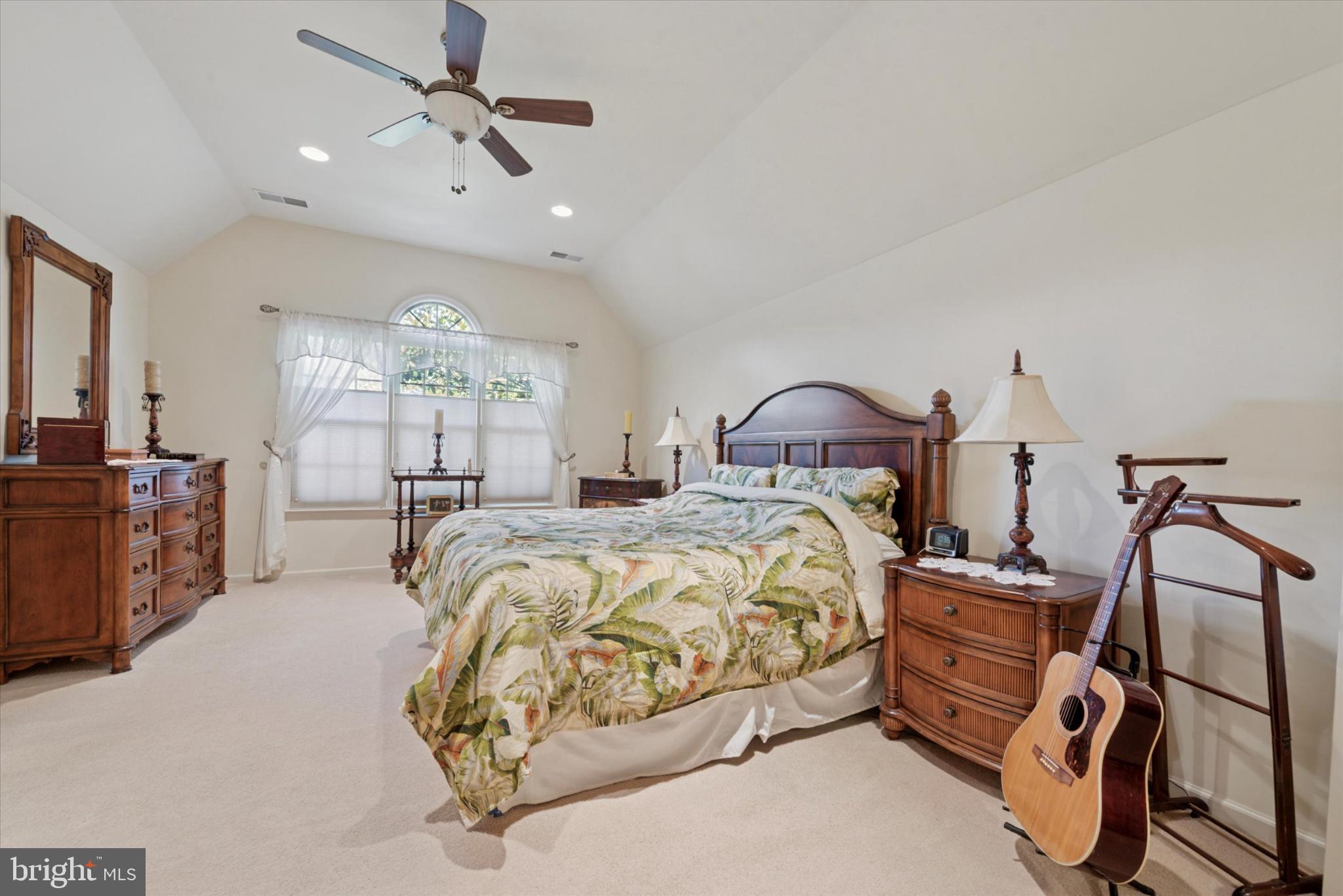856 Monteith Drive Wayne, PA 19087 - Photo 27 of 35 a bedroom with a bed and a chandelier