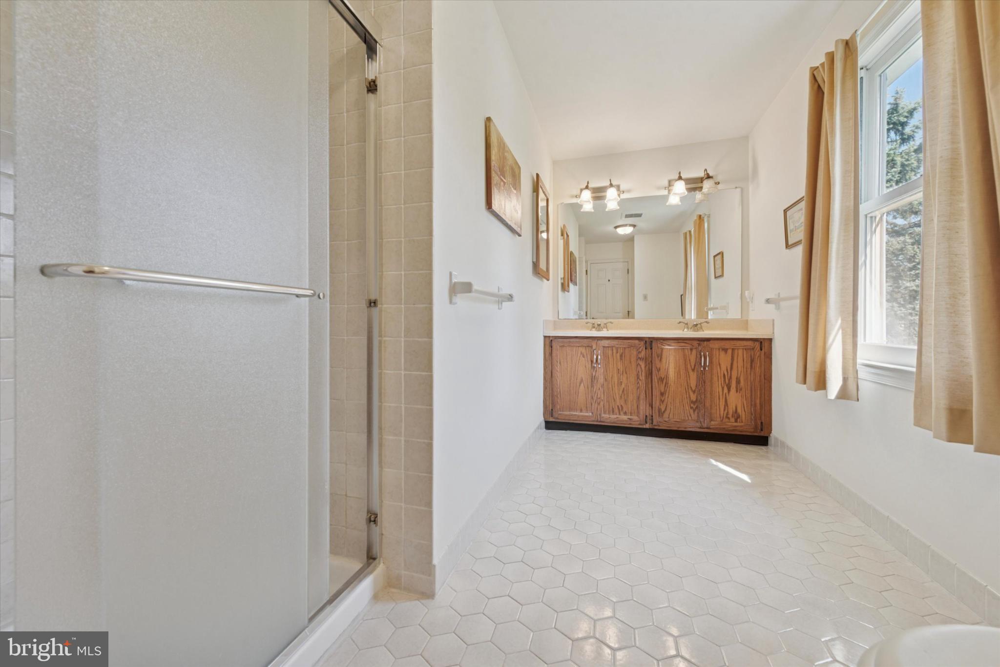 856 Monteith Drive Wayne, PA 19087 - Photo 32 of 35 a view of a bathroom with bathtub and shower