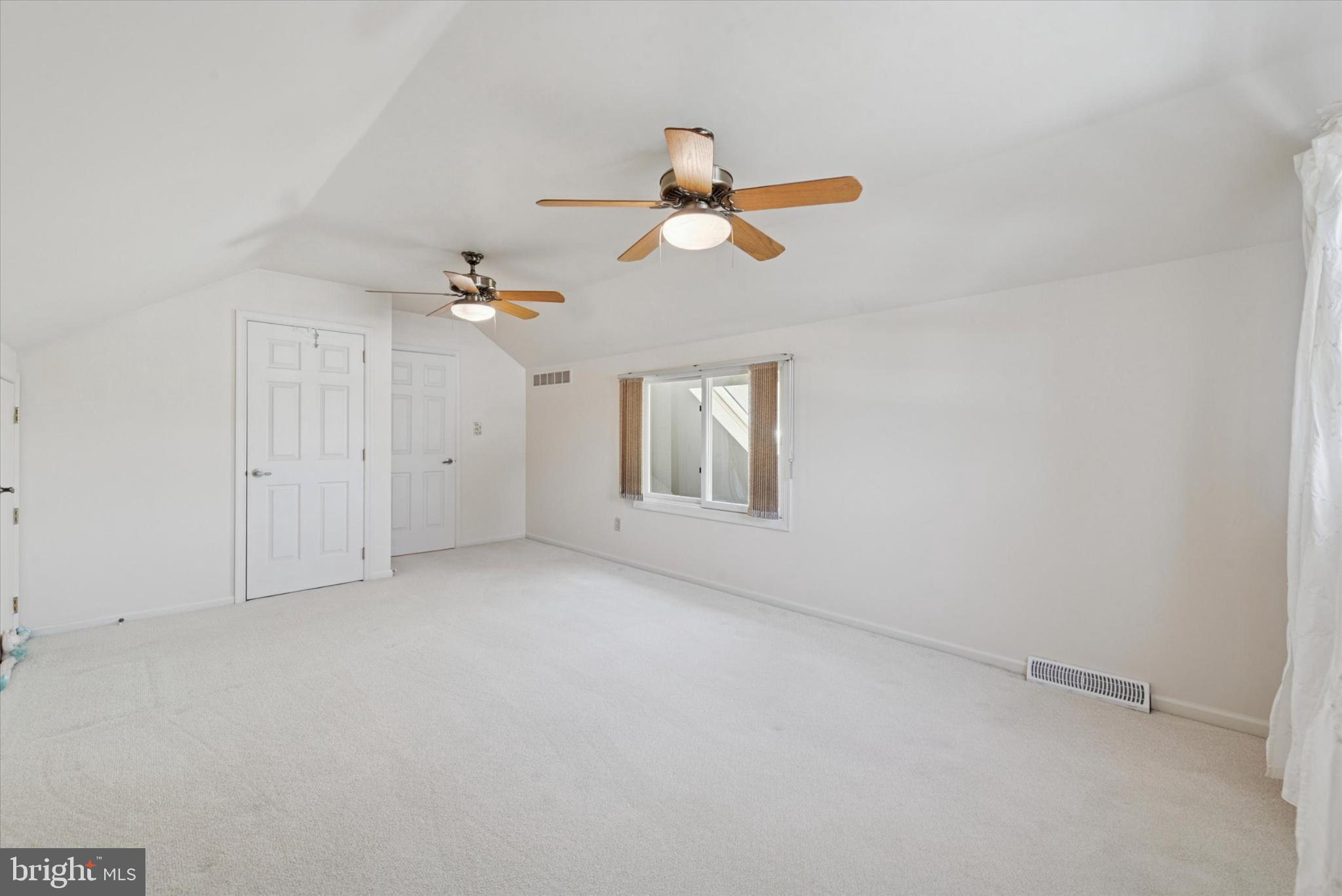 856 Monteith Drive Wayne, PA 19087 - Photo 33 of 35 an empty room with a window and ceiling fan