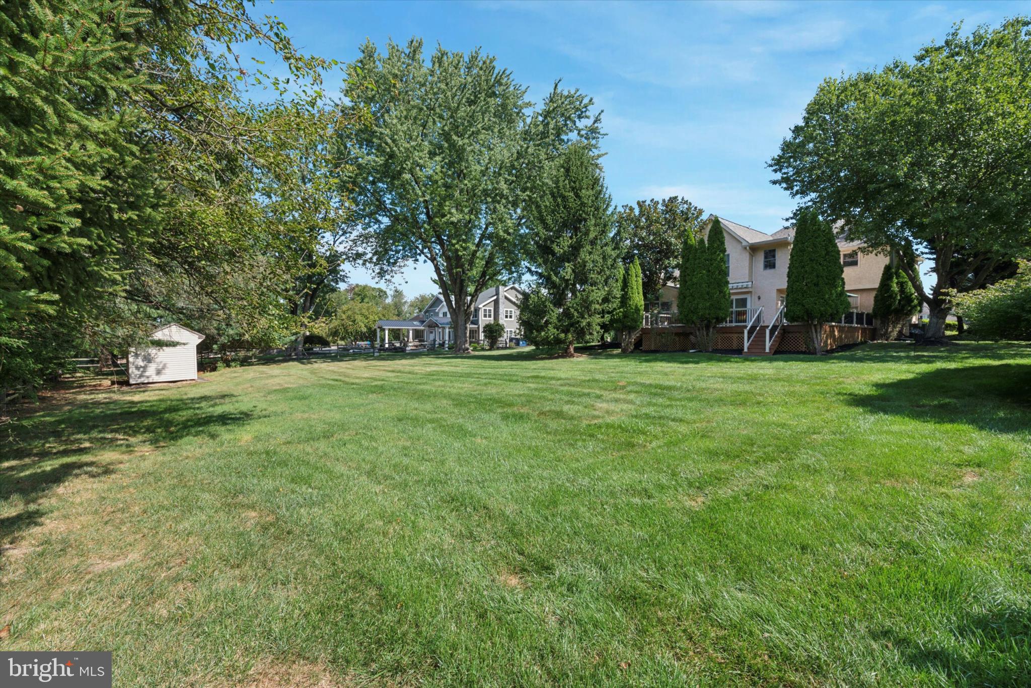 856 Monteith Drive Wayne, PA 19087 - Photo 4 of 35 a view of a grassy field with trees
