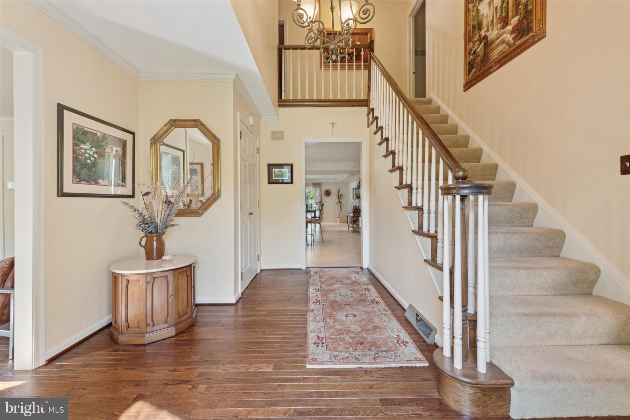 856 Monteith Drive Wayne, PA 19087 - Photo 10 of 35 a view of a hallway with wooden floor and staircase