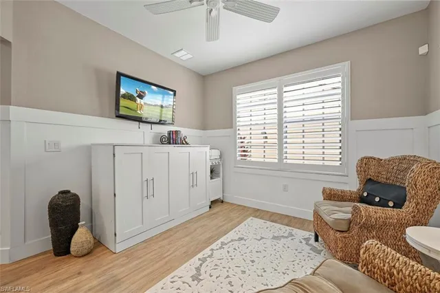 a living room with furniture and a window